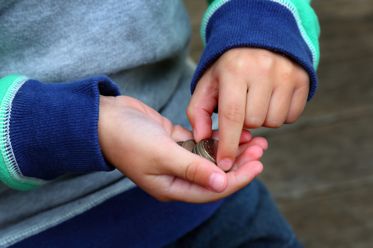 boy with pocket money for chores