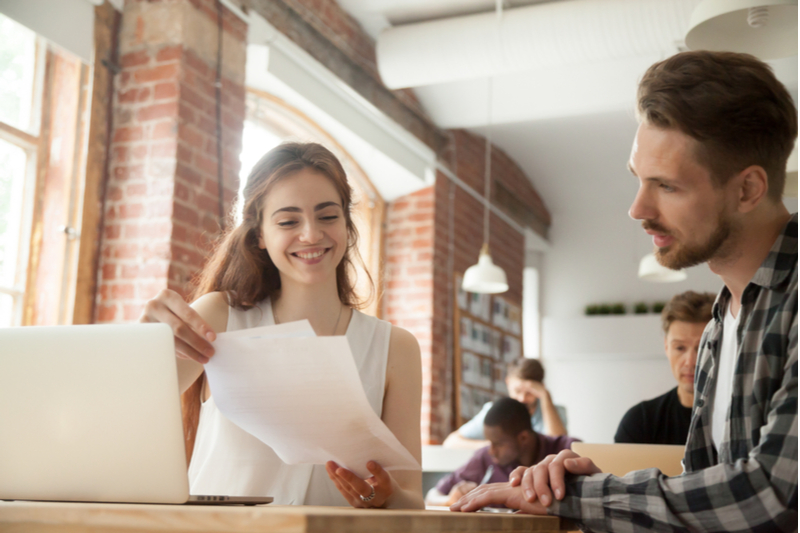 man talking to HR manager in office